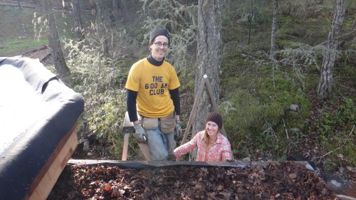 Tayler and Solara from Hatchet & Seed helping to install living roof layers on the new Eco-Hut. 
