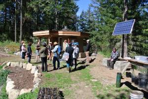 Tour group in front of Eco-Hut (office for farm business)